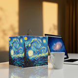 super driven  world  Art Decor Cube Lamp Featuring The Starry Night painting by Vincent van Gogh next to a laptop on table .this a great unique gift 
