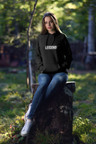pretty girl in the woods wearing super driven legend black motivational eco-friendly hoodie