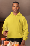 Man  holding a glass of wine wearing super driven  bee focused sun yellow hoodie