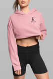 girl  in a grey background wearing a pale pink super driven future billionaire motivation crop hoodie a great present for  entrepreneurs 