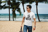 man  carrying a bag while walking  on the beach in his white super driven hustler state of mind  unique motivational t-shirt a great present for entrepreneurs